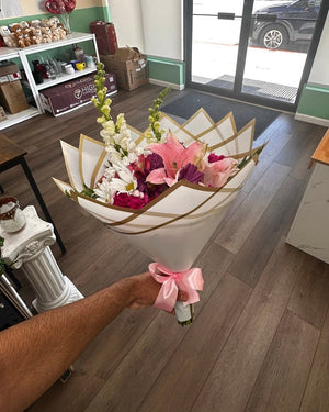 Blushing Lotus Bouquet - pink lilies, daisies and snapdragons in a lotus wrap