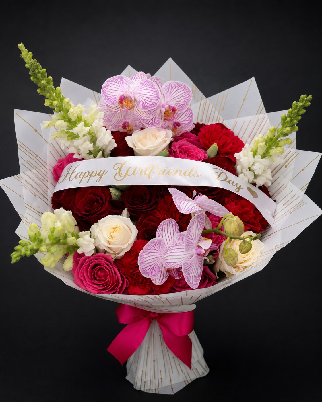 Happy Girlfriend's Day bouquet with red and pink roses, orchids and snapdragons