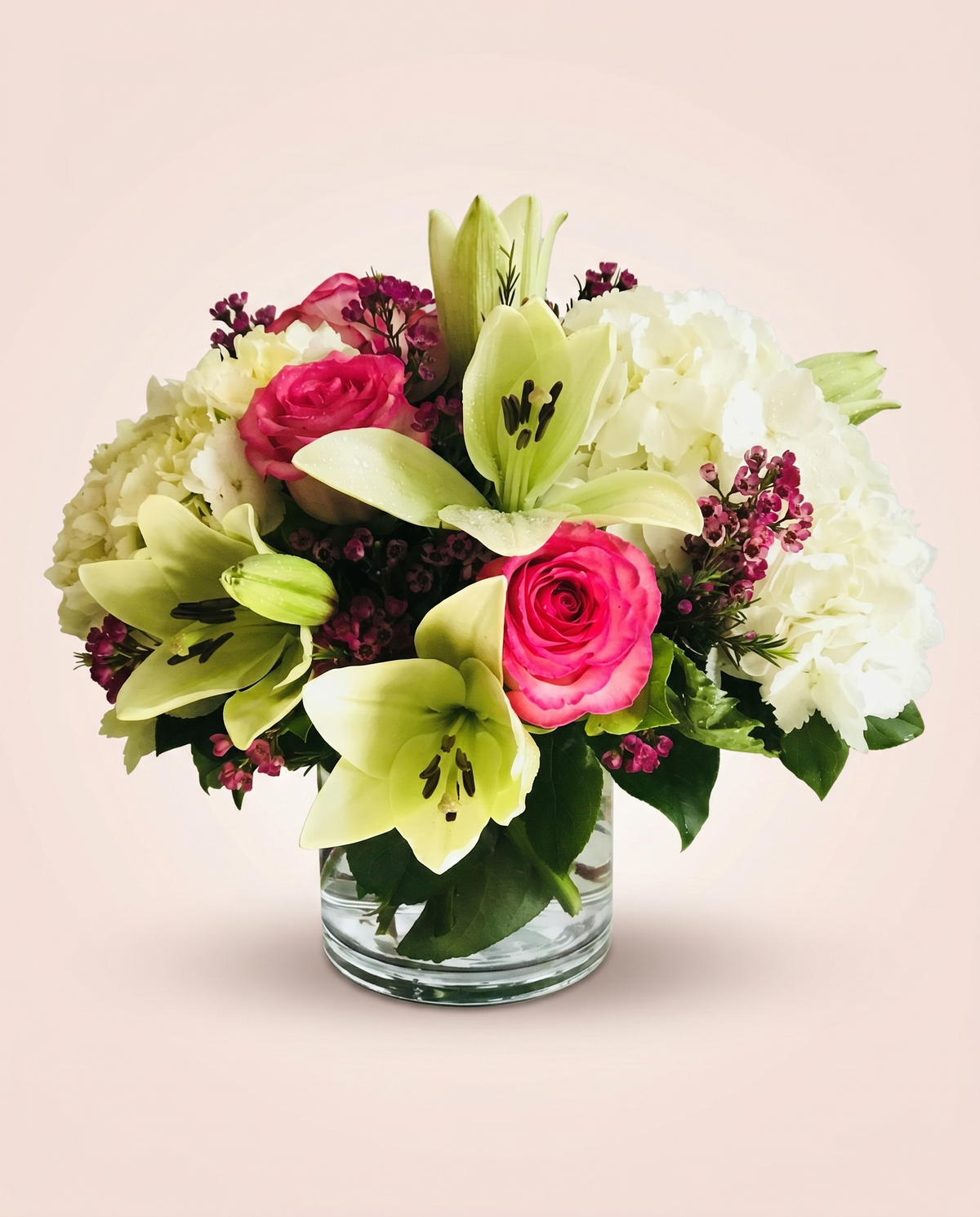 Rose & Lily Serenade — pink roses, white lilies, and hydrangea in a glass vase