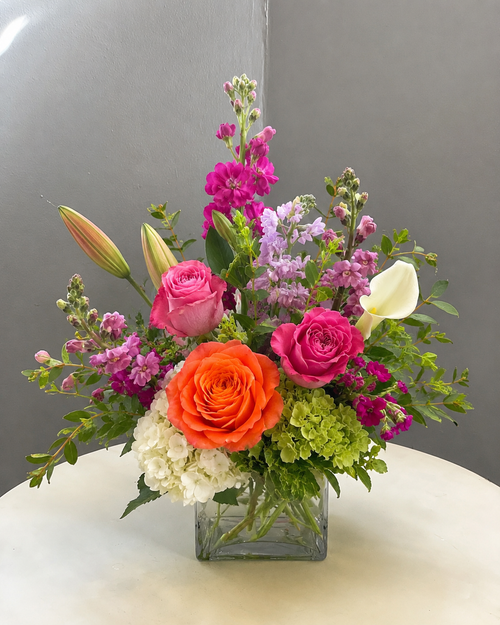 Standard Coral Lily Garden bouquet with fewer flowers and more greenery