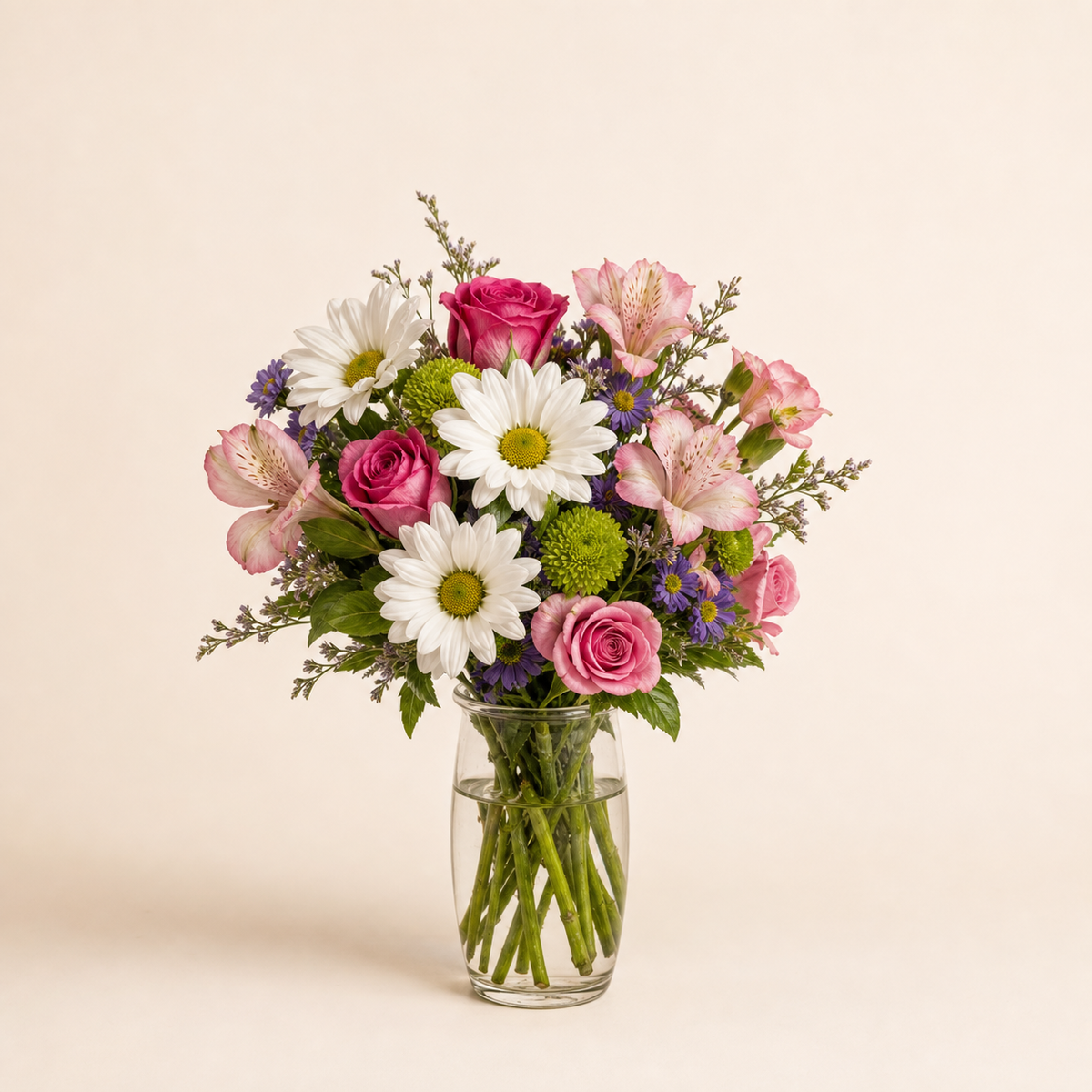 Daisy Delight standard size fresh flower arrangement in a clear glass vase
