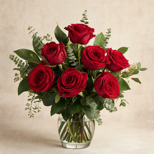 Divine Devotion Standard – compact arrangement of red roses with green eucalyptus and lemon leaf in a clear glass vase, smaller lighter version