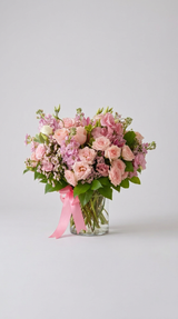 Pink Rose Lisianthus and Purple Stock Flower Arrangement in Glass Vase as shown