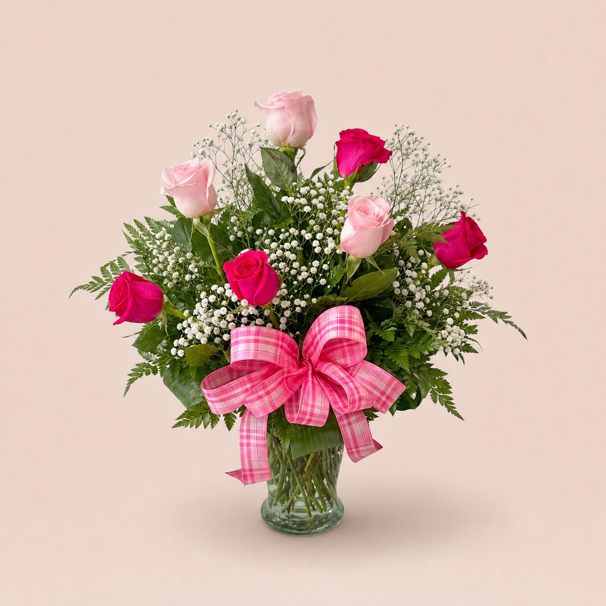 Pink Crush Roses smaller Standard arrangement with pink roses, baby's breath, greenery, plaid bow, and clear glass vase