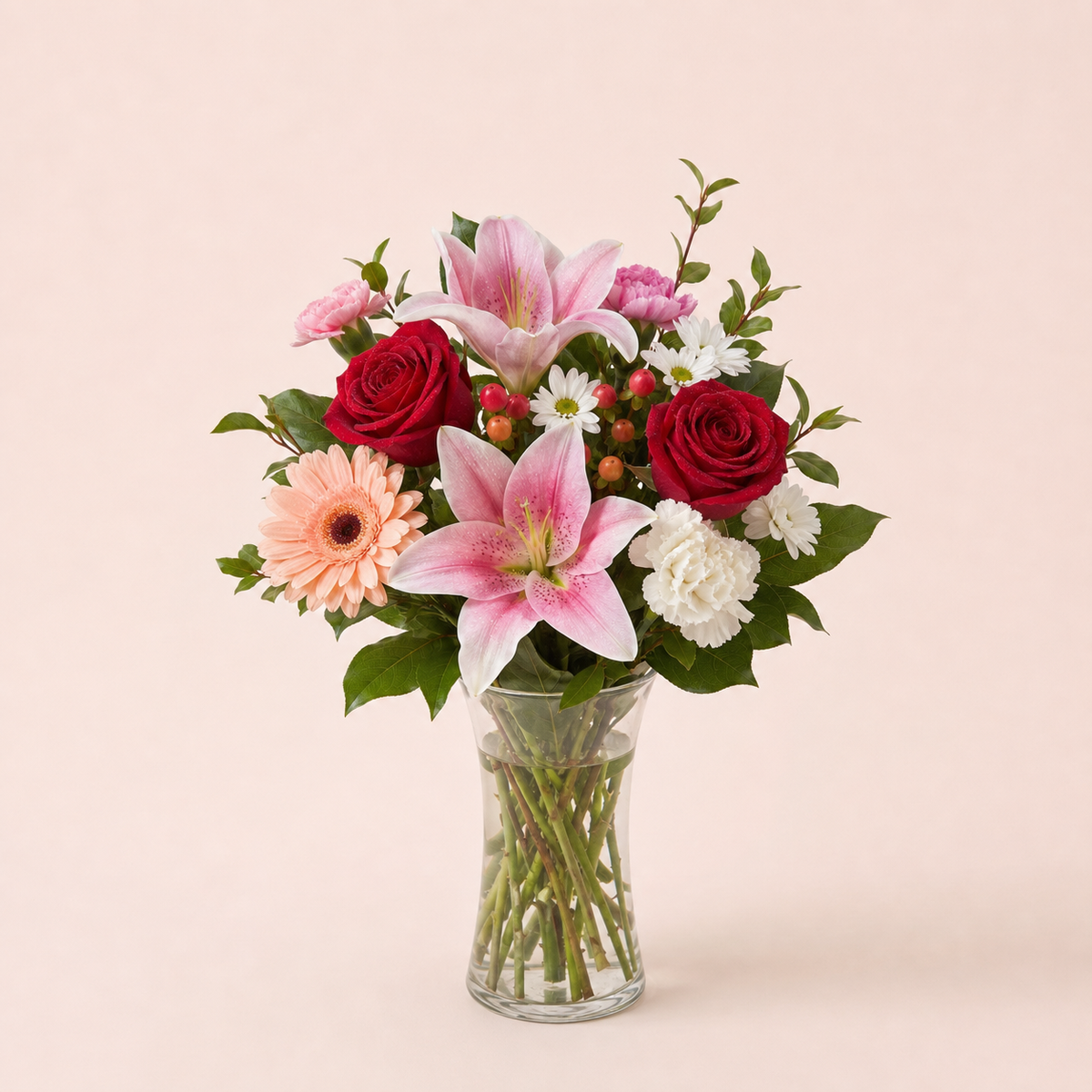 Rosé Daydream Bouquet smaller Standard arrangement in a tall clear glass vase
